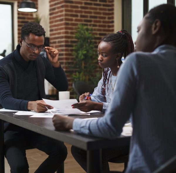 african-american-research-agency-coworkers-meeting-about-startup-project-financial-status-business-people-desk-company-office-finance-department-talking-about-marketing-expenses (2) (2)