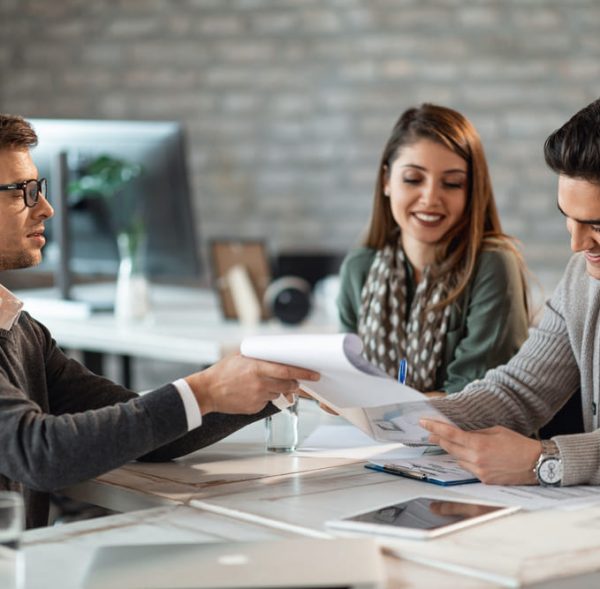 happy-couple-signing-contract-meeting-with-their-real-estate-agent-office (1) (1)