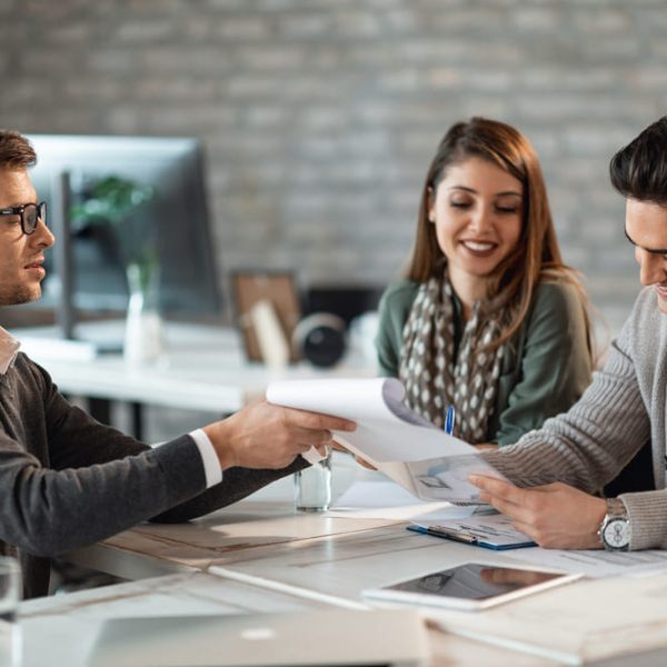 happy-couple-signing-contract-meeting-with-their-real-estate-agent-office (1) (1)