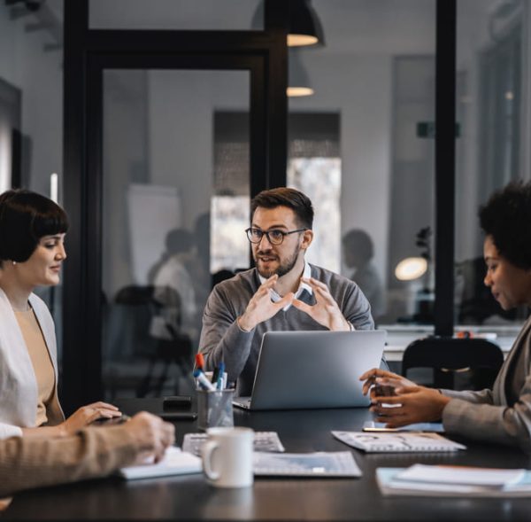 senior-manager-is-sitting-boardroom-with-multiracial-colleagues-discussing-project (1) (2)